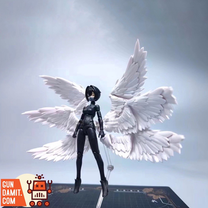 RCW 1/12 white angel wings attached to mecha girl figure with dramatic spread RCW 1/12 white angel wings attached to mecha girl figure with dramatic spread