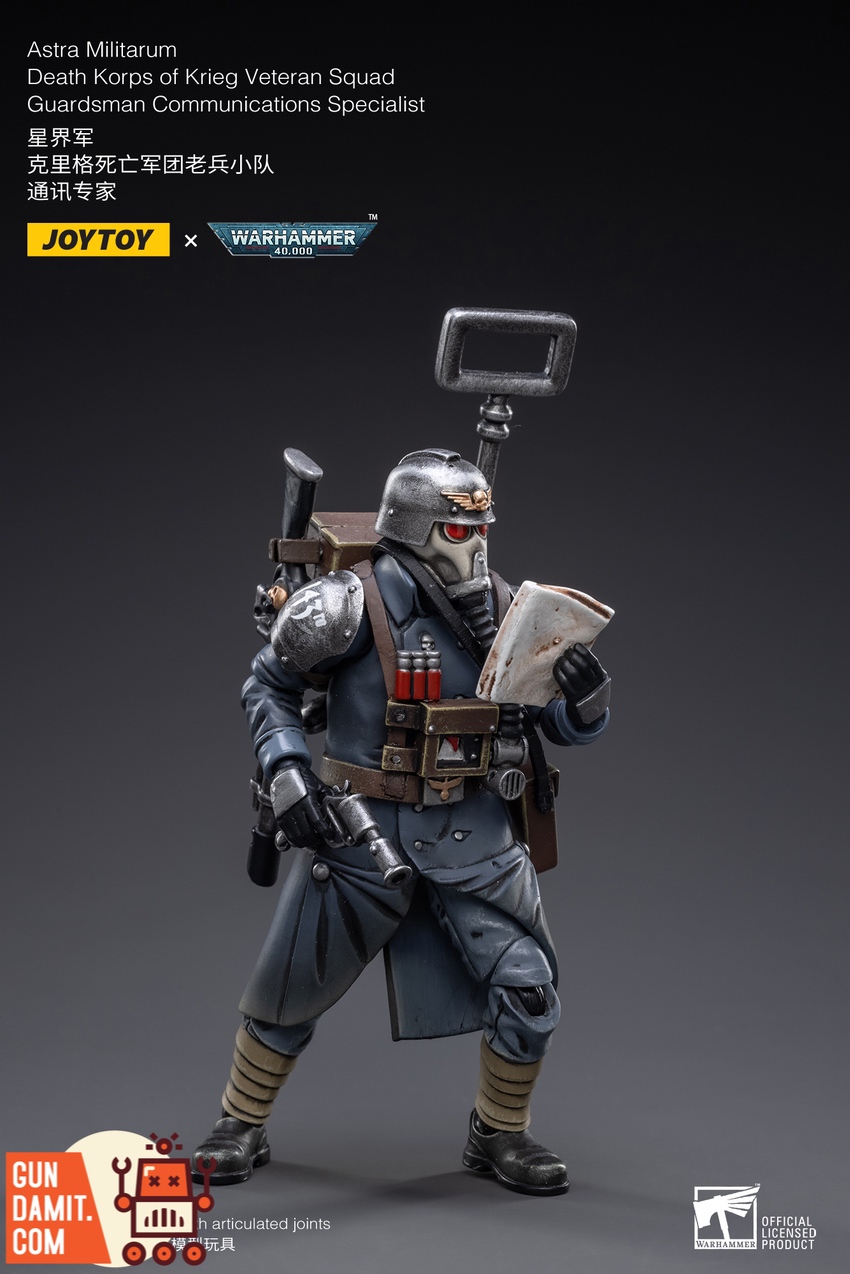 JoyToy 1/18 Krieg Veteran Comms Specialist action pose holding map and laspistol JoyToy 1/18 Krieg Veteran Comms Specialist action pose holding map and laspistol