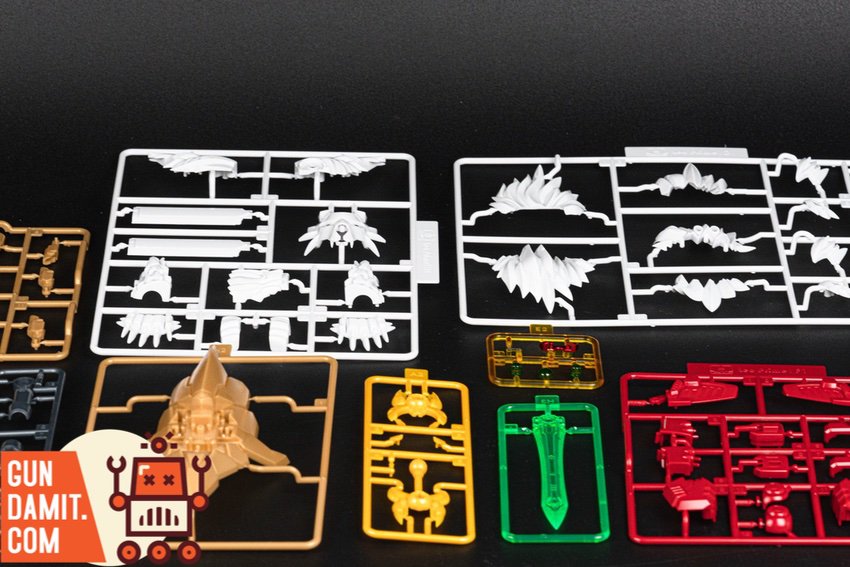 Close-up of Leo Prime runner sprues showing detailed white fur parts and gold lion head shield components Close-up of Leo Prime runner sprues showing detailed white fur parts and gold lion head shield components