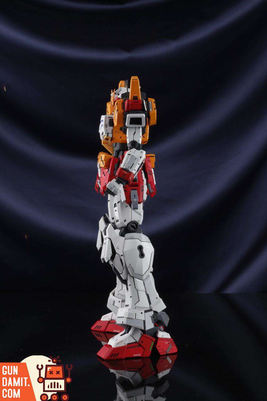 SH Studio 1/60 HeavyArms EW garage kit side profile showing orange and red shoulder missile pods on black background SH Studio 1/60 HeavyArms EW garage kit side profile showing orange and red shoulder missile pods on black background