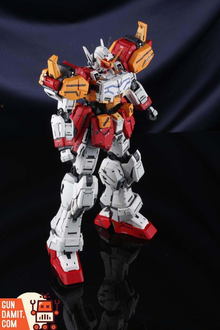 Dynamic three-quarter pose of HeavyArms EW garage kit highlighting shoulder armor and arm-mounted weaponry Dynamic three-quarter pose of HeavyArms EW garage kit highlighting shoulder armor and arm-mounted weaponry
