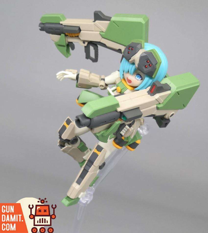 Close-up of Feidy figure with blue hair wielding large rifle in aerial action pose on clear stand Close-up of Feidy figure with blue hair wielding large rifle in aerial action pose on clear stand