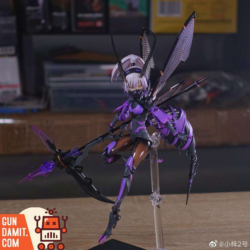 Full body dynamic pose of BEE-04R San-Ye figure with all four wings spread and crossbow weapon in attacking stance Full body dynamic pose of BEE-04R San-Ye figure with all four wings spread and crossbow weapon in attacking stance