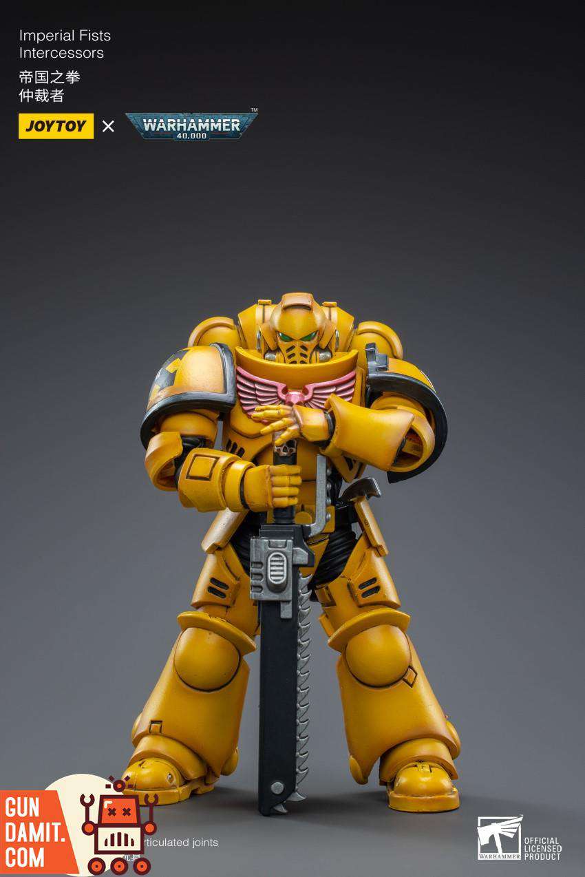 JoyToy Imperial Fists Intercessor front view in yellow power armor holding chainsword JoyToy Imperial Fists Intercessor front view in yellow power armor holding chainsword