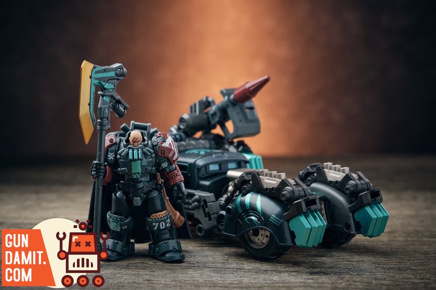 Warrior figure with battle axe banner standing beside disassembled assault trike vehicle Warrior figure with battle axe banner standing beside disassembled assault trike vehicle