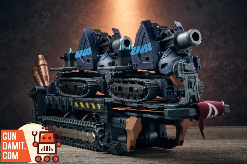 Heavy assault tracked vehicle with dual cannons and missile launchers in dark navy color scheme Heavy assault tracked vehicle with dual cannons and missile launchers in dark navy color scheme