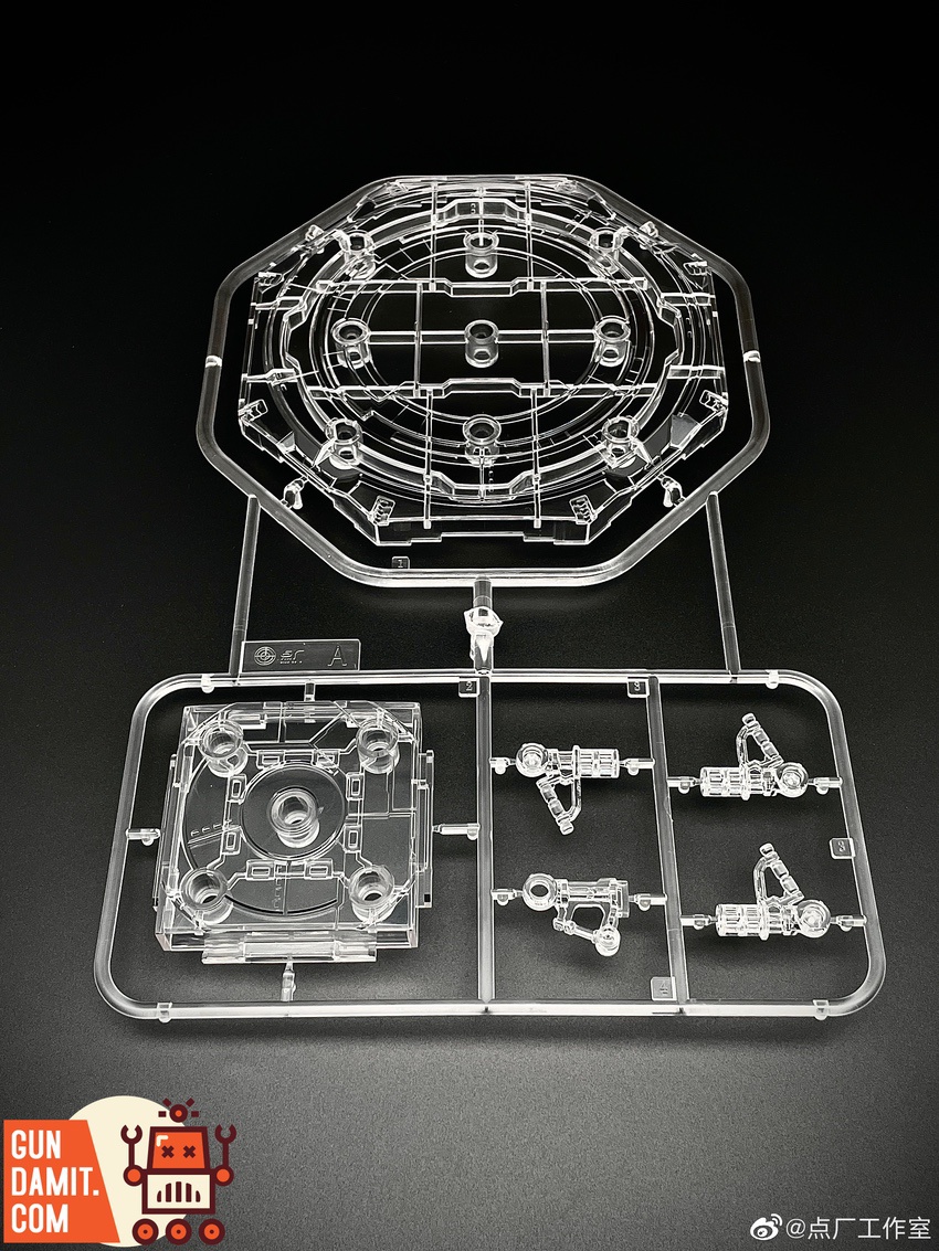 Runner A showing octagonal base plate and support arm parts in clear plastic Runner A showing octagonal base plate and support arm parts in clear plastic