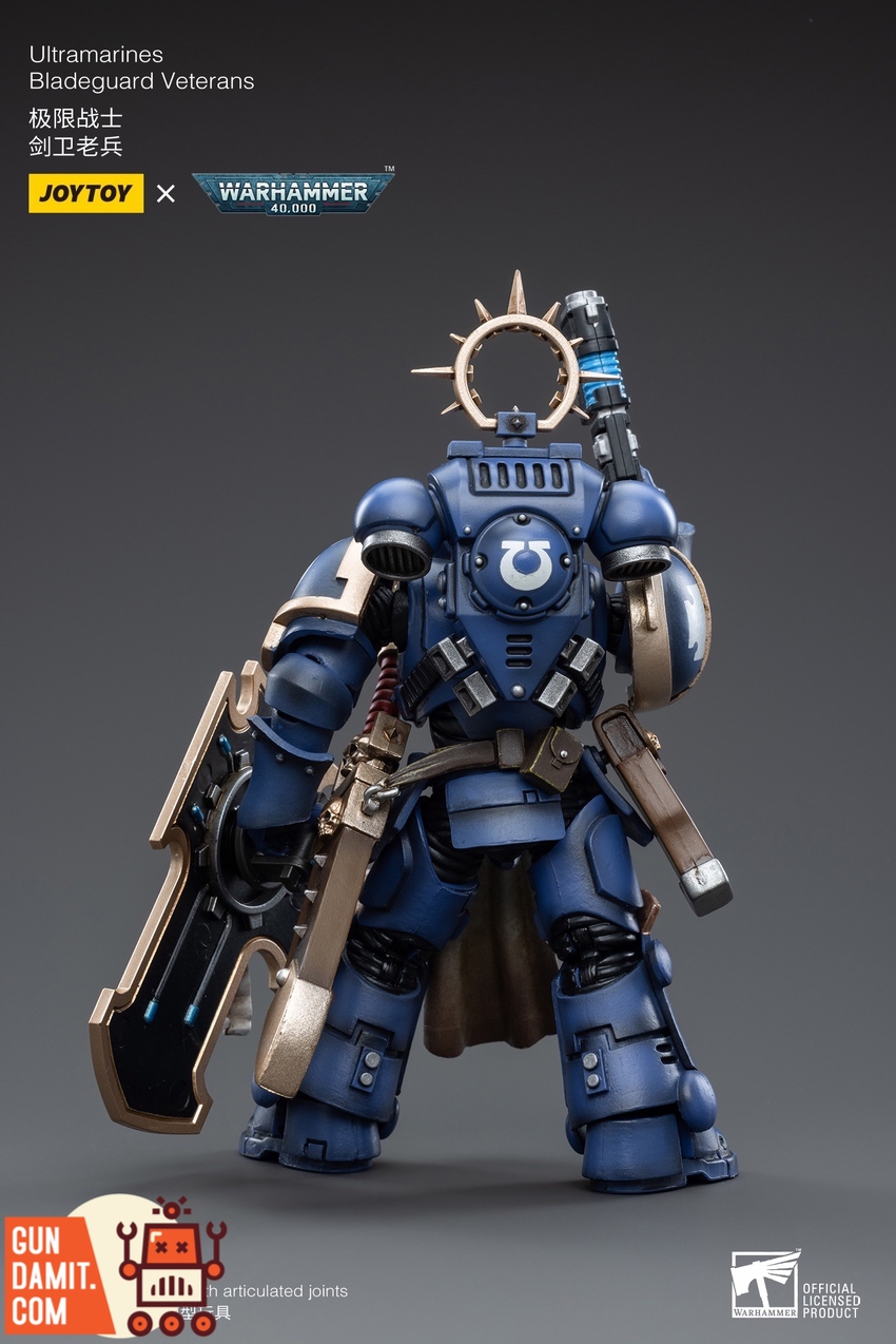 Bladeguard Veterans close-up showing detailed blue power armor and gold halo Bladeguard Veterans close-up showing detailed blue power armor and gold halo