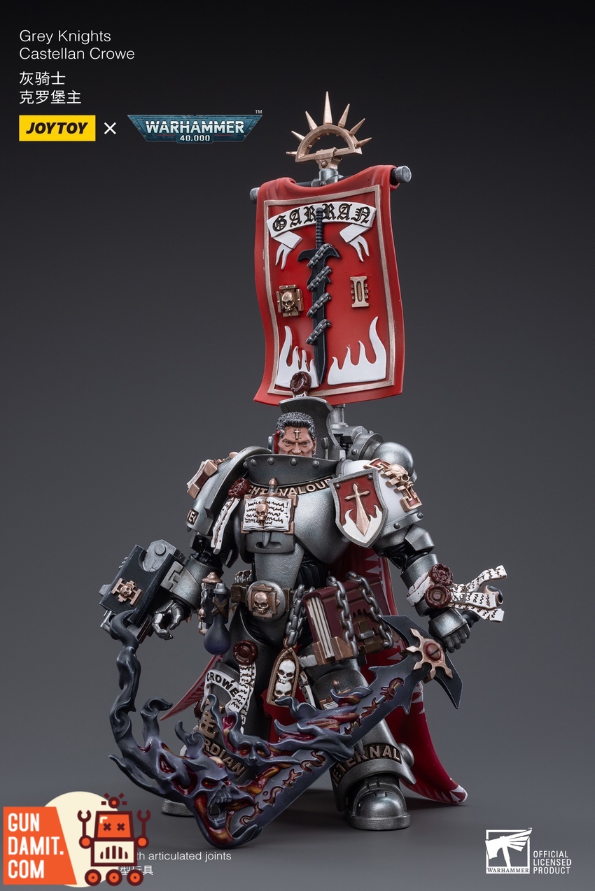 Castellan Crowe silver power armor close-up with red banner details Castellan Crowe silver power armor close-up with red banner details