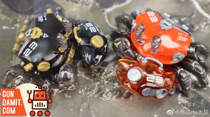 Two mechanical fiddler crab models in outdoor water scene Two mechanical fiddler crab models in outdoor water scene