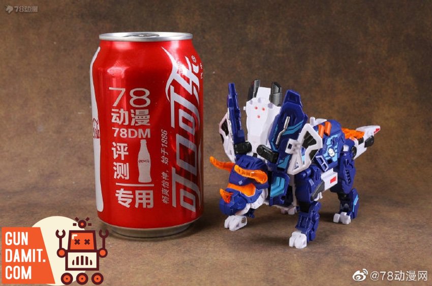 52Toys BeastBox BB-55 Triceratops 2.0 Sigma dinosaur mode with blue armor next to soda can for scale 52Toys BeastBox BB-55 Triceratops 2.0 Sigma dinosaur mode with blue armor next to soda can for scale