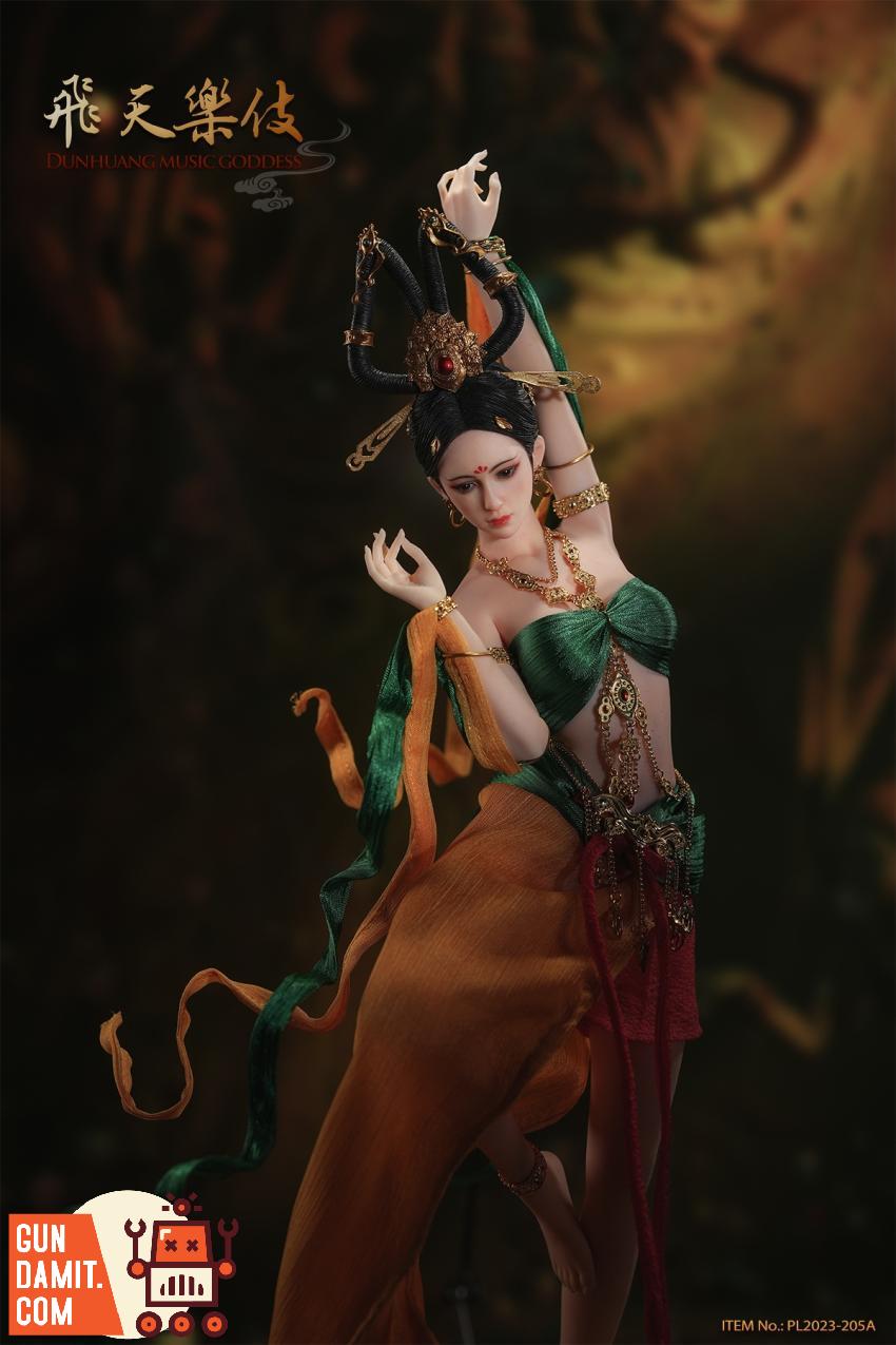 Music Goddess rear view with flowing green scarves and headdress Music Goddess rear view with flowing green scarves and headdress