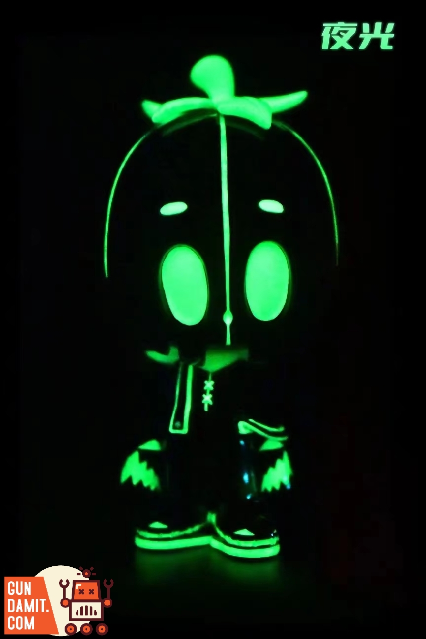 Glow-in-the-dark effect showing Dico figure with green luminous pumpkin mask in darkness Glow-in-the-dark effect showing Dico figure with green luminous pumpkin mask in darkness
