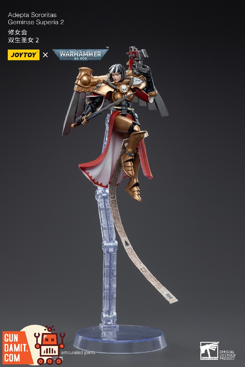 Side view of Geminae Superia 2 airborne with bolt pistol and flowing red cape on articulated stand Side view of Geminae Superia 2 airborne with bolt pistol and flowing red cape on articulated stand