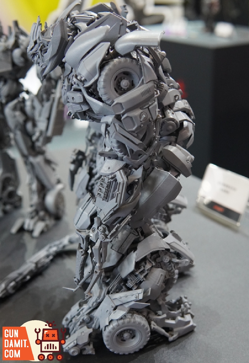 Rear three-quarter view of Megatron unpainted prototype showing full body mechanical complexity Rear three-quarter view of Megatron unpainted prototype showing full body mechanical complexity