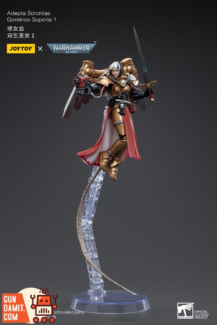 Geminae Superia 1 in aerial pose wielding bolt pistol and sword on transparent flight stand Geminae Superia 1 in aerial pose wielding bolt pistol and sword on transparent flight stand