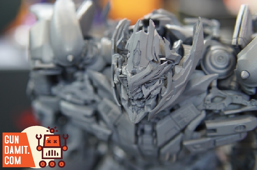 Close-up of Megatron head sculpt showing intricate alien mechanical face detail on unpainted prototype Close-up of Megatron head sculpt showing intricate alien mechanical face detail on unpainted prototype