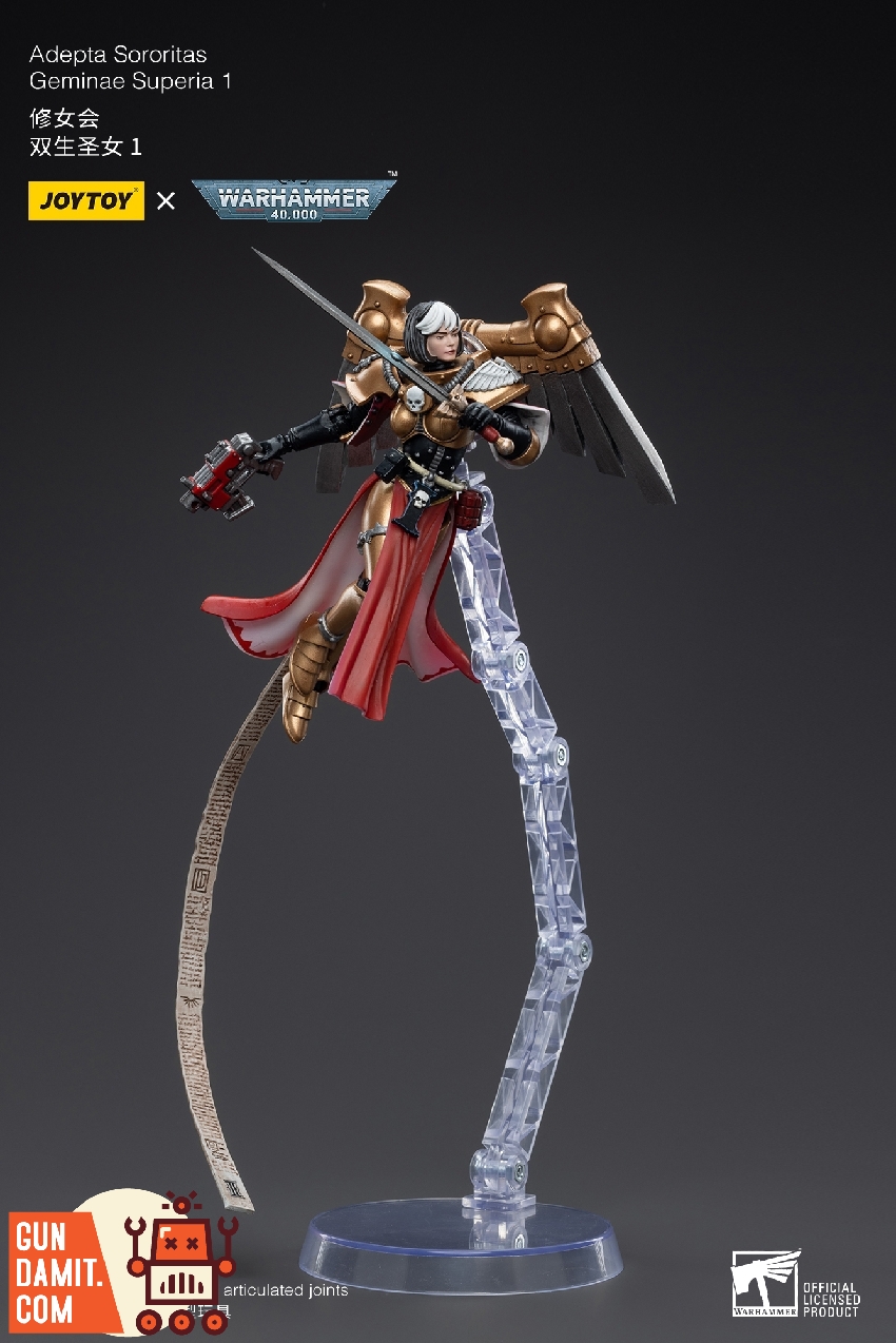 Geminae Superia 1 aerial combat pose with outstretched sword on clear stand with red cape Geminae Superia 1 aerial combat pose with outstretched sword on clear stand with red cape