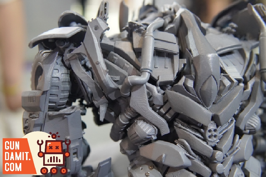 Upper body detail of Megatron model kit showing chest mechanics and arm joint construction Upper body detail of Megatron model kit showing chest mechanics and arm joint construction