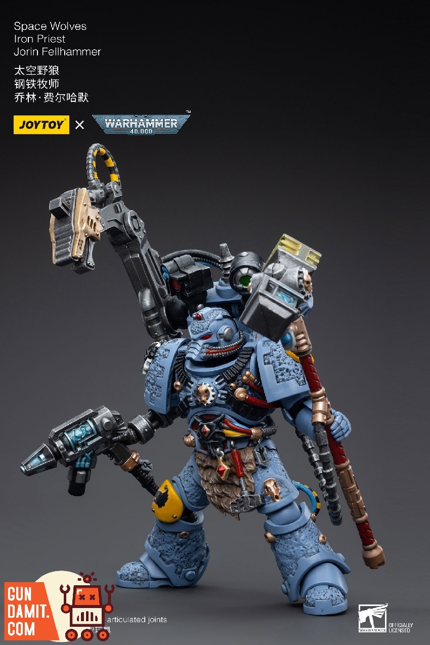 Iron Priest Fellhammer figure in blue-grey armor with mechanical servo-arm and tools Iron Priest Fellhammer figure in blue-grey armor with mechanical servo-arm and tools