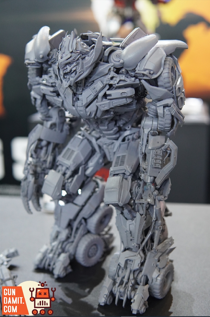 Front three-quarter view of Megatron DOTM model kit prototype at exhibition booth Front three-quarter view of Megatron DOTM model kit prototype at exhibition booth