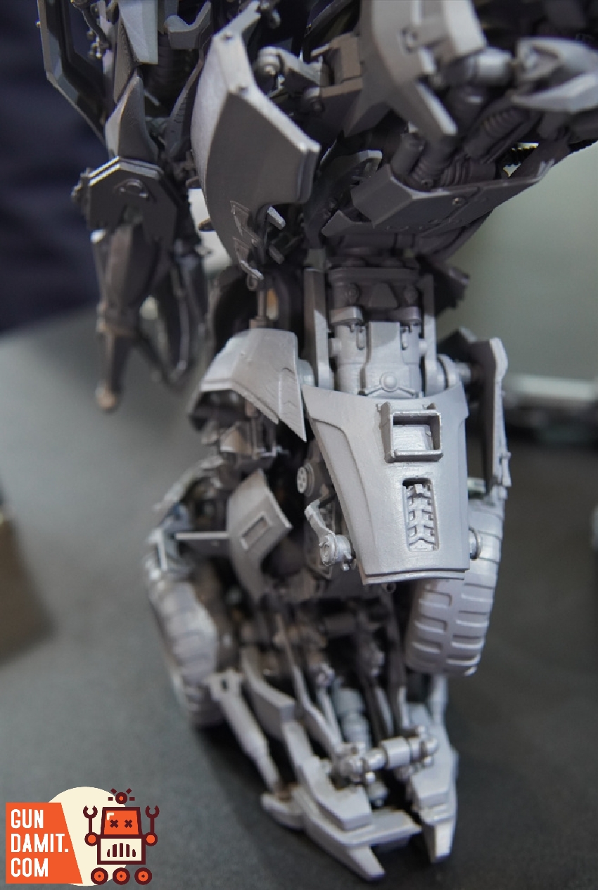 Lower body detail of Megatron prototype displaying leg armor with tank treads and mechanical joints Lower body detail of Megatron prototype displaying leg armor with tank treads and mechanical joints