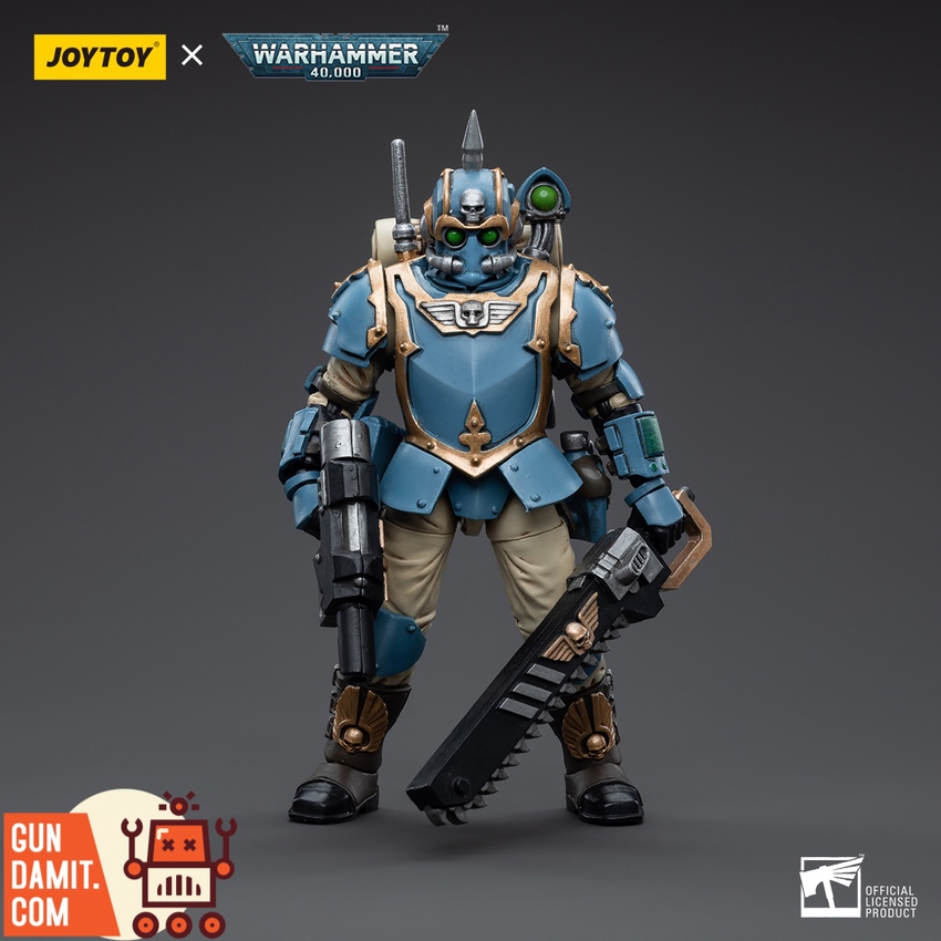 Front standing pose of 55th Kappic Eagles Tempestor in blue carapace armor with chainsword and hot-shot laspistol Front standing pose of 55th Kappic Eagles Tempestor in blue carapace armor with chainsword and hot-shot laspistol