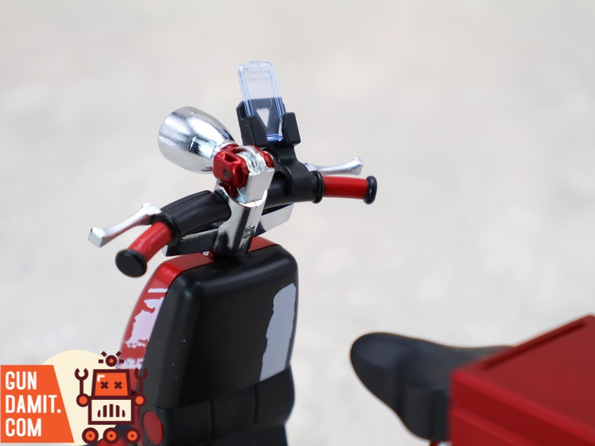 GB-01 red scooter handlebar close-up showing chrome detail and phone holder GB-01 red scooter handlebar close-up showing chrome detail and phone holder