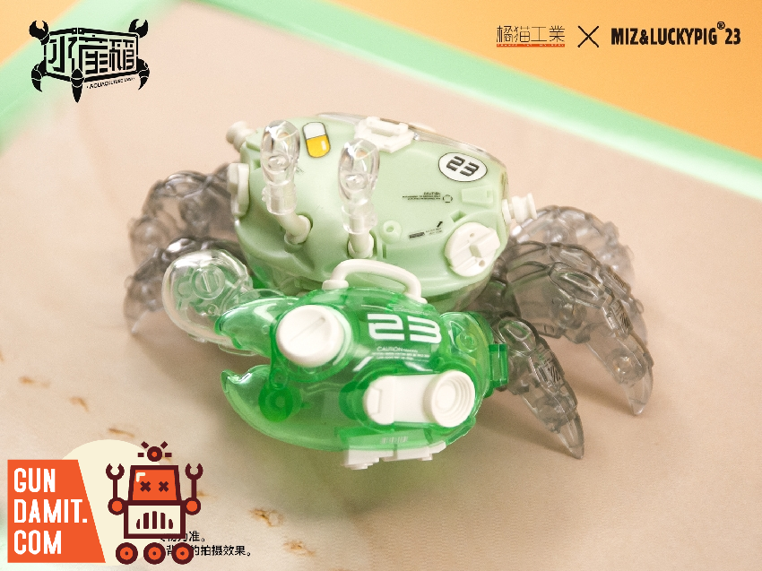 Side view of mint green Fiddler Crab showing oversized translucent claw and numbered shell marking Side view of mint green Fiddler Crab showing oversized translucent claw and numbered shell marking