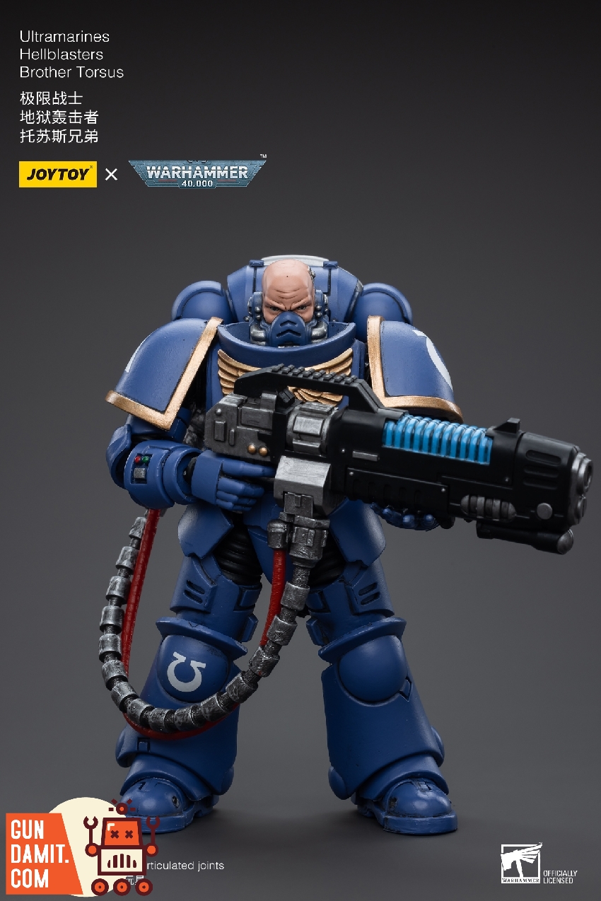 Brother Torsus with exposed head holding plasma incinerator with blue energy coils in firing stance Brother Torsus with exposed head holding plasma incinerator with blue energy coils in firing stance