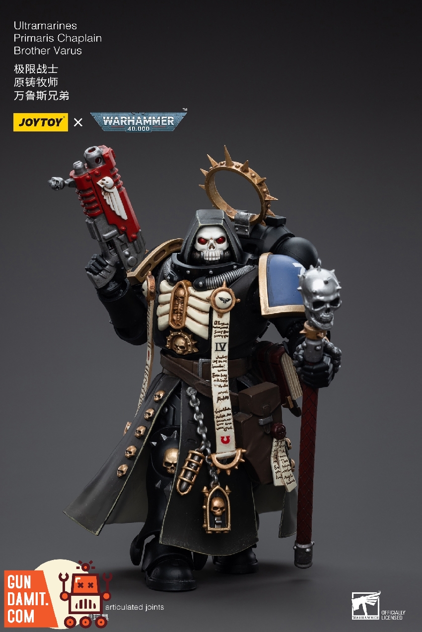 Brother Varu in black chaplain armor with skull helmet and blue Ultramarines shoulder pad holding crozius Brother Varu in black chaplain armor with skull helmet and blue Ultramarines shoulder pad holding crozius