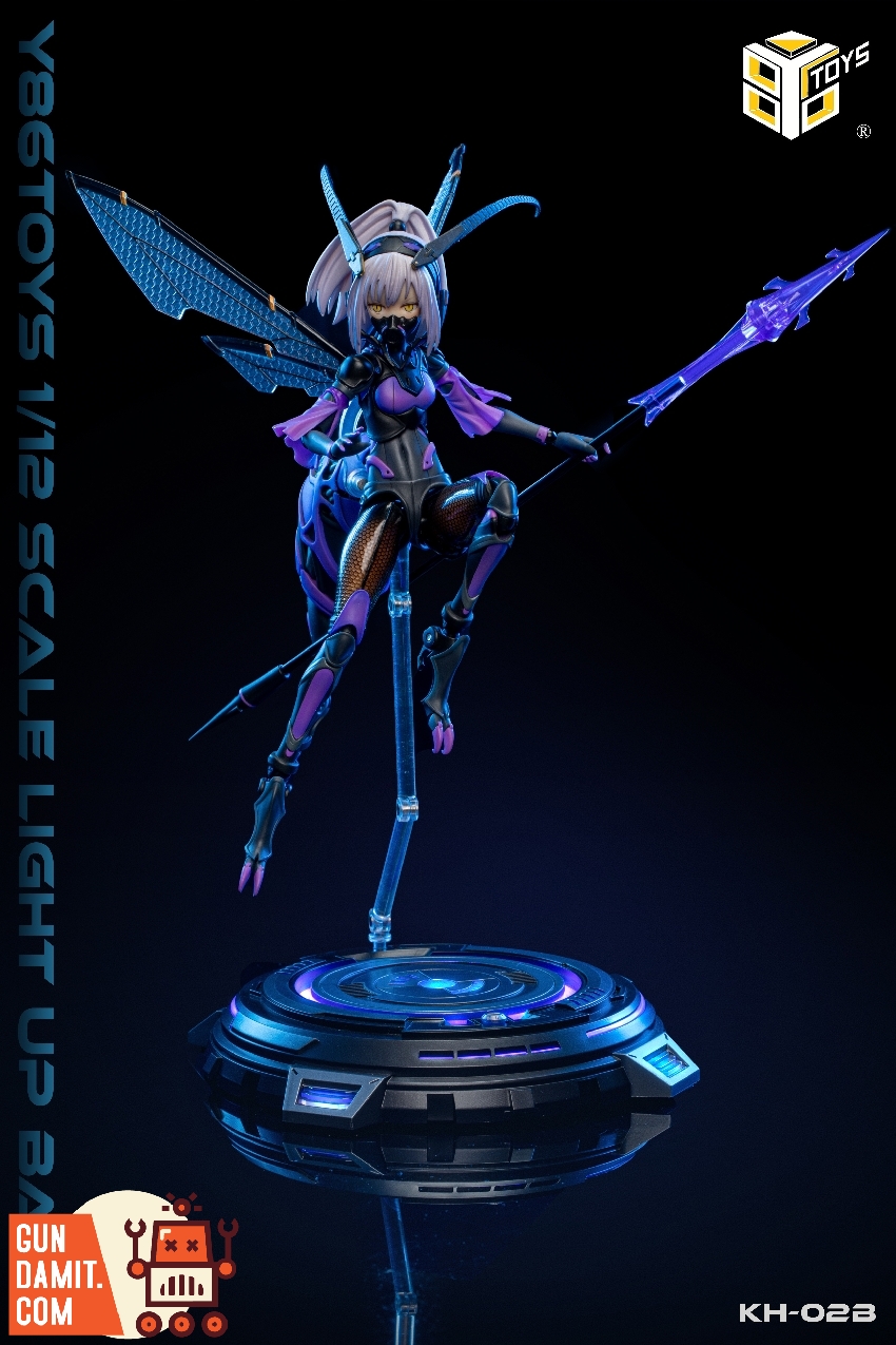 Insect-winged mecha girl figure displayed on illuminated KH-02B display base with purple LED glow Insect-winged mecha girl figure displayed on illuminated KH-02B display base with purple LED glow