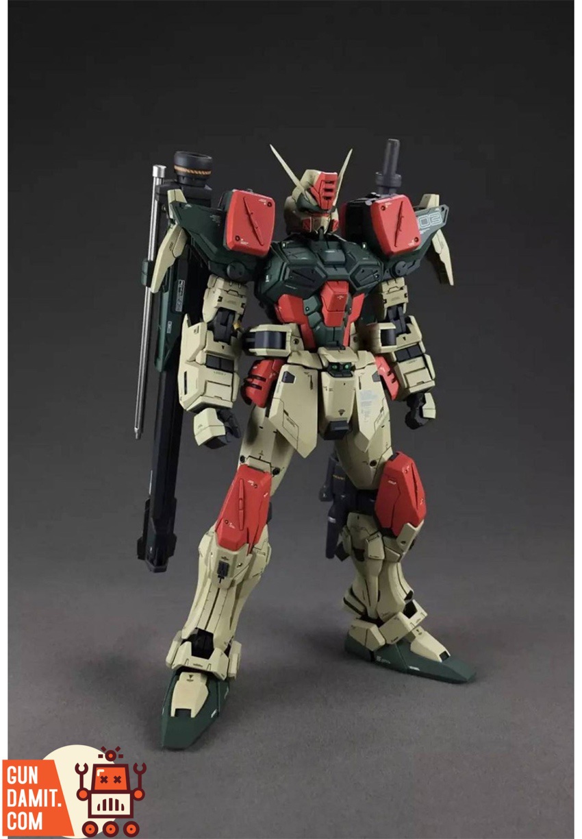 Front standing view of Buster Gundam with dual shoulder-mounted launchers in olive drab and red colors Front standing view of Buster Gundam with dual shoulder-mounted launchers in olive drab and red colors