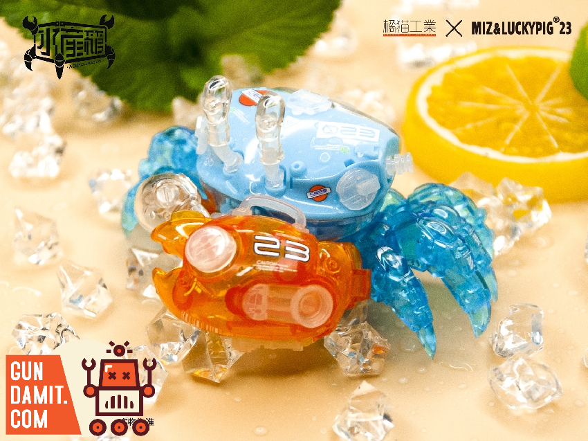 Orange Cat Industry Fiddler Crab Gulf Blue model kit in translucent blue posed among ice cubes and lemon slice Orange Cat Industry Fiddler Crab Gulf Blue model kit in translucent blue posed among ice cubes and lemon slice