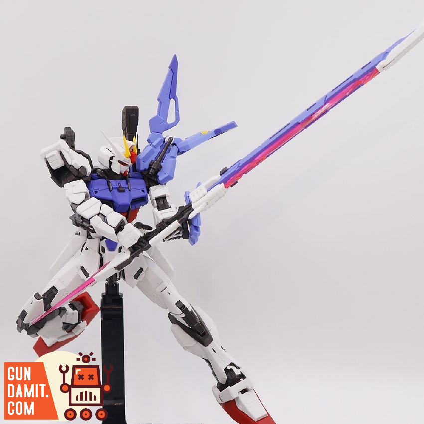 Sword Strike Gundam in white blue and red colors wielding large anti-ship sword with pink beam blade Sword Strike Gundam in white blue and red colors wielding large anti-ship sword with pink beam blade