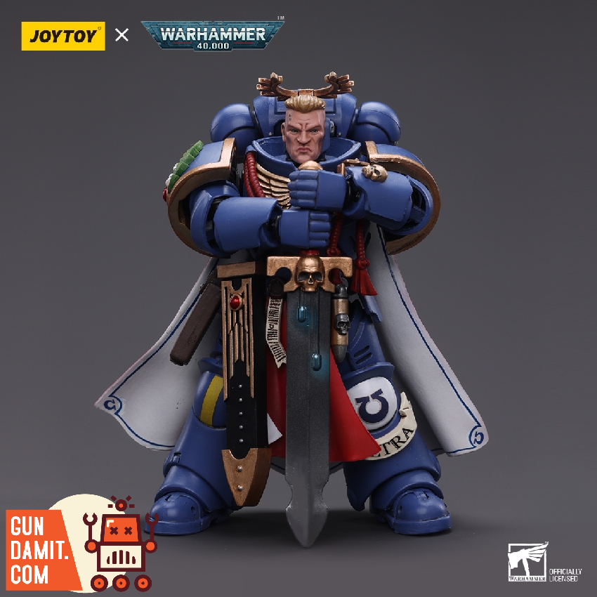 JoyToy 1/18 Warhammer 40K Ultramarines Primaris Captain standing with power sword and cape front view JoyToy 1/18 Warhammer 40K Ultramarines Primaris Captain standing with power sword and cape front view