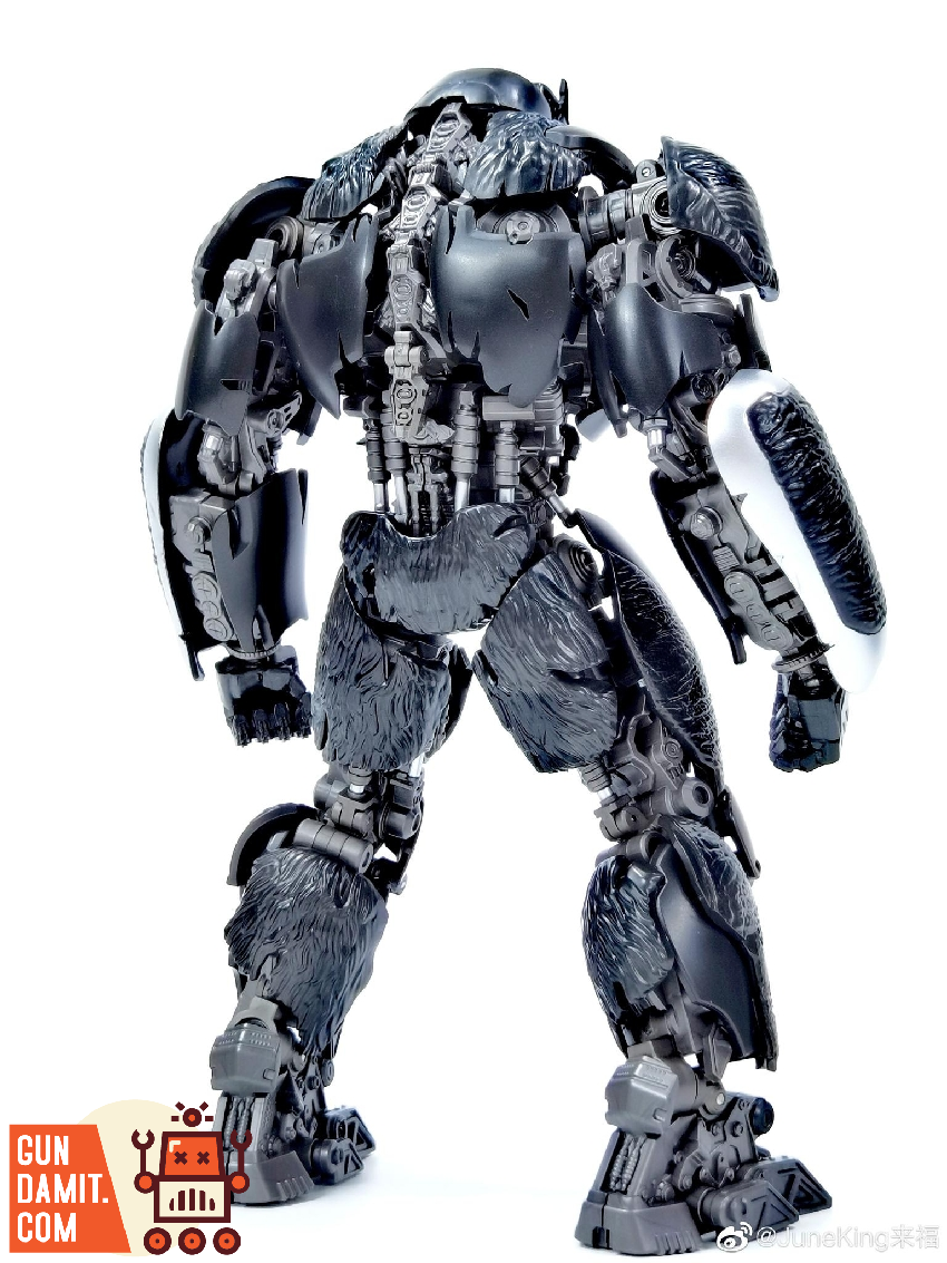 Optimus Primal model kit full body standing pose showing detailed dark metallic surface textures Optimus Primal model kit full body standing pose showing detailed dark metallic surface textures