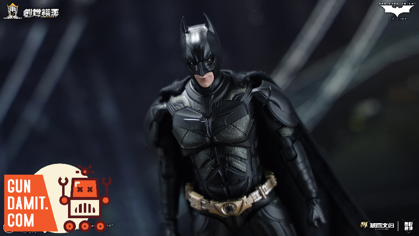 Batman standing with cape draped showing detailed black armor plating and utility belt Batman standing with cape draped showing detailed black armor plating and utility belt