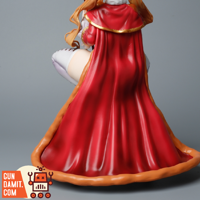 Man Xiang 1/6 Margarita figure rear view showing flowing red royal robe on decorative base Man Xiang 1/6 Margarita figure rear view showing flowing red royal robe on decorative base