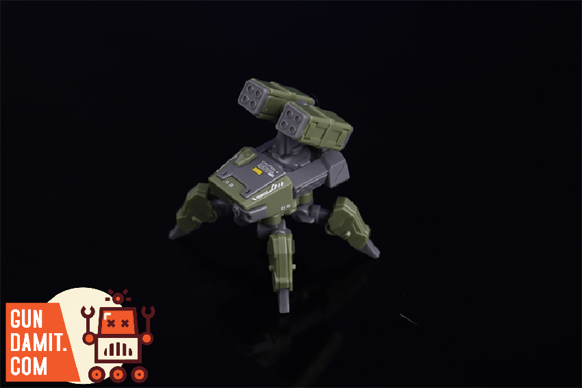 Chief Continent 1/144 Wolf Spider Squad mecha model front view with missile launchers in olive green colorway Chief Continent 1/144 Wolf Spider Squad mecha model front view with missile launchers in olive green colorway