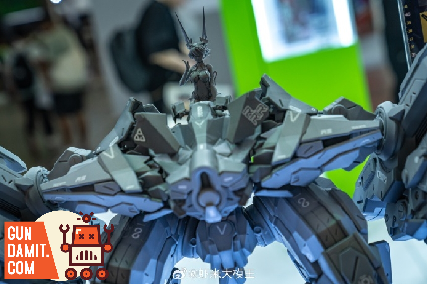 HowlingStar Walker Frame Thunder Storm assembled model kit in dark gray and blue finish displayed at hobby exhibition with spread wings HowlingStar Walker Frame Thunder Storm assembled model kit in dark gray and blue finish displayed at hobby exhibition with spread wings