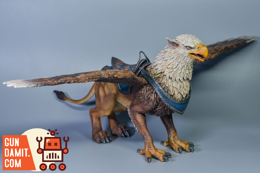 D20 Studio brown Griffin figure with spread wings showing brown and white feather coloring and saddle harness D20 Studio brown Griffin figure with spread wings showing brown and white feather coloring and saddle harness