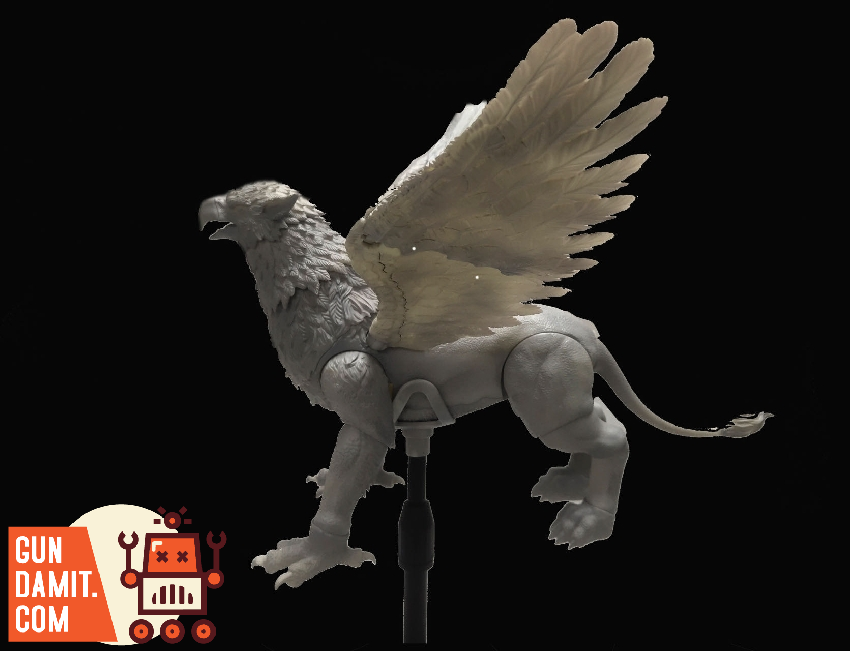 D20 Studio white Griffin figure on display stand showing eagle head and lion body with raised wings D20 Studio white Griffin figure on display stand showing eagle head and lion body with raised wings