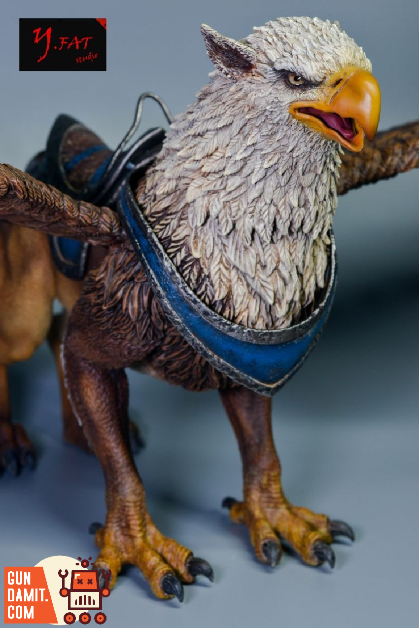 D20 Studio brown Griffin figure front view showing eagle head detail and blue leather saddle harness D20 Studio brown Griffin figure front view showing eagle head detail and blue leather saddle harness