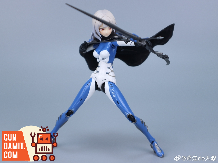 MUSE figure in attack pose with cape billowing behind and sword at ready in blue outfit MUSE figure in attack pose with cape billowing behind and sword at ready in blue outfit