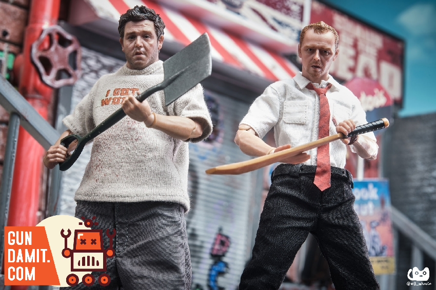 Zombie Fatty with shovel and Zombie Slim with cricket bat in back-to-back action pose against red graffiti wall Zombie Fatty with shovel and Zombie Slim with cricket bat in back-to-back action pose against red graffiti wall