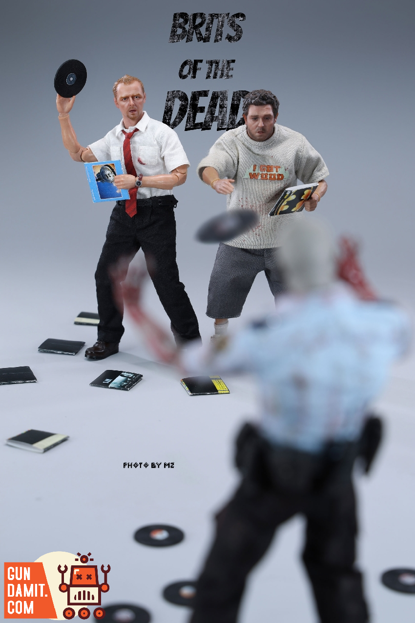 Zombie Slim throwing vinyl record at zombies while Zombie Fatty watches in convenience store diorama Zombie Slim throwing vinyl record at zombies while Zombie Fatty watches in convenience store diorama