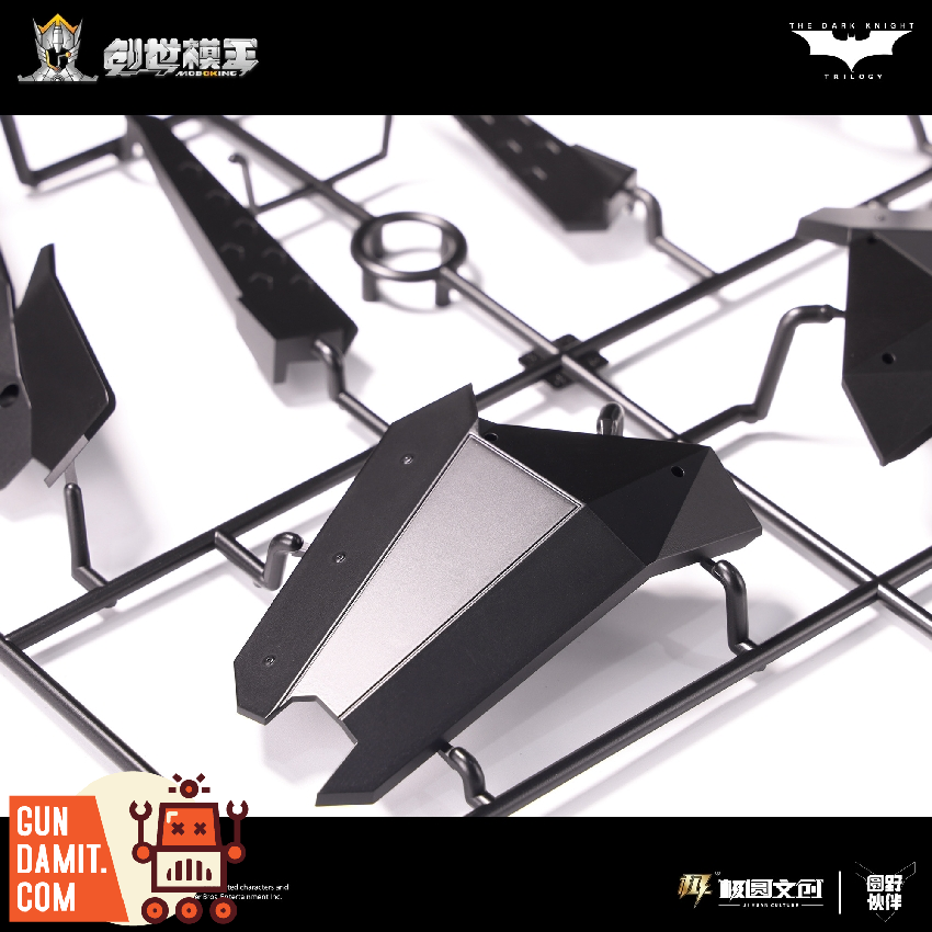 Model kit runner sprue for Batmobile showing black injection-molded parts on frame Model kit runner sprue for Batmobile showing black injection-molded parts on frame