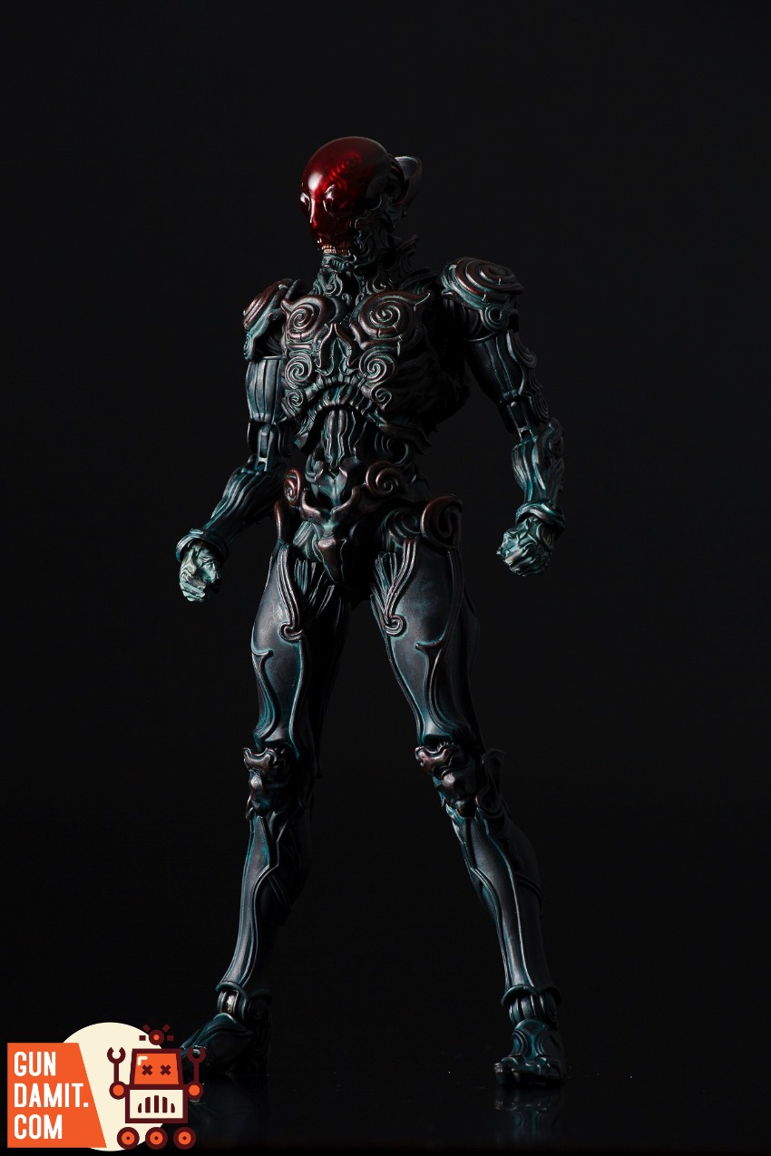 Sentinel Toys 1000toys Takayuki Takeya Jomon Puppet Black Bo A dark, intricately designed robot figure with a red, glowing he Sentinel Toys 1000toys Takayuki Takeya Jomon Puppet Black Bo A dark, intricately designed robot figure with a red, glowing he