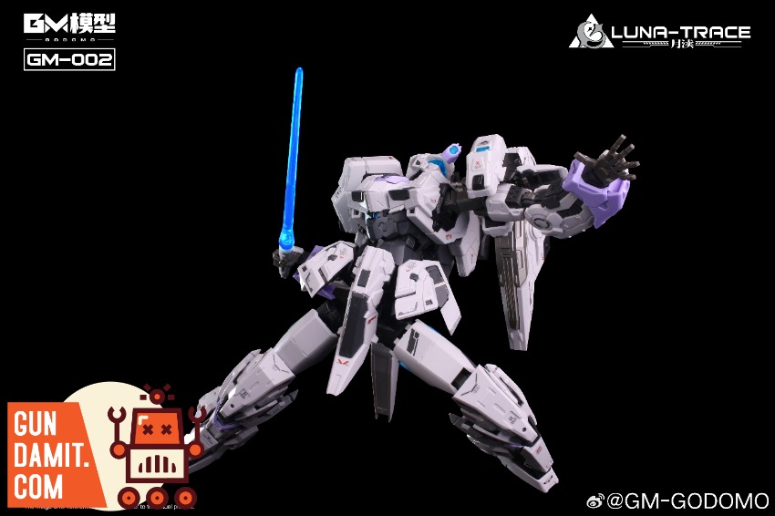 GODOMO GM-002 Yue Du Model Kit A white and purple Gundam model kit is displayed against a black background. GODOMO GM-002 Yue Du Model Kit A white and purple Gundam model kit is displayed against a black background.
